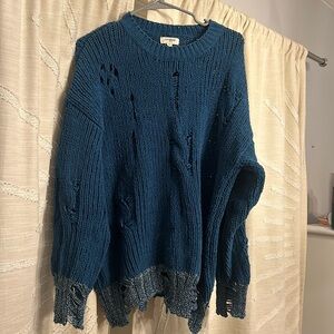 Distressed blue sweater with silver trim